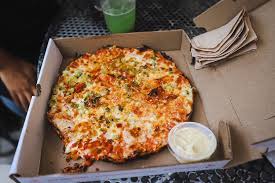 Bow Market signature dishes Varies by vendor; includes pizza from Pizza Posto, tacos from Taquisimo, and dumplings from Jaju Pierogi.